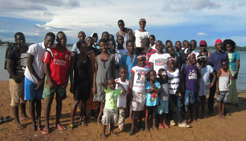 A group portrait of the happy children supported by the Isaac's House charity.
